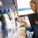 Store Manager Controlling Stocks On Shelves